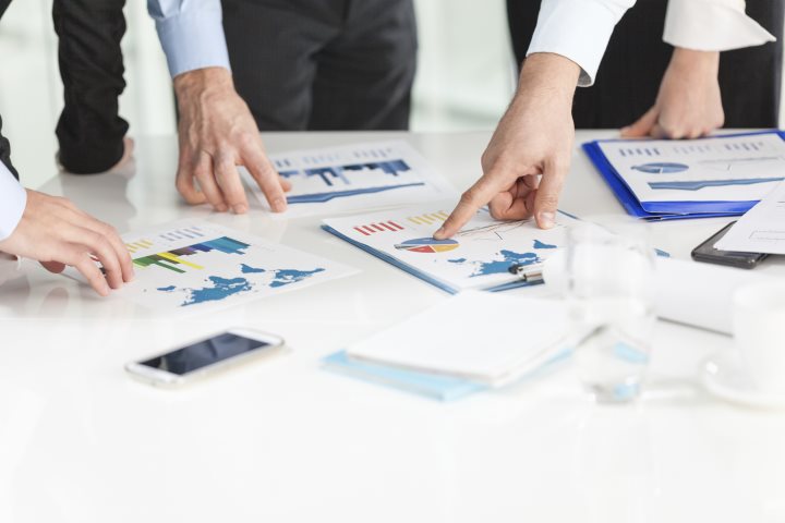 Business people analyzing charts.